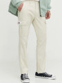 detail Tommy Jeans pánské krémové kalhoty