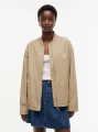 detail Tommy Hilfiger dámská béžová bunda
