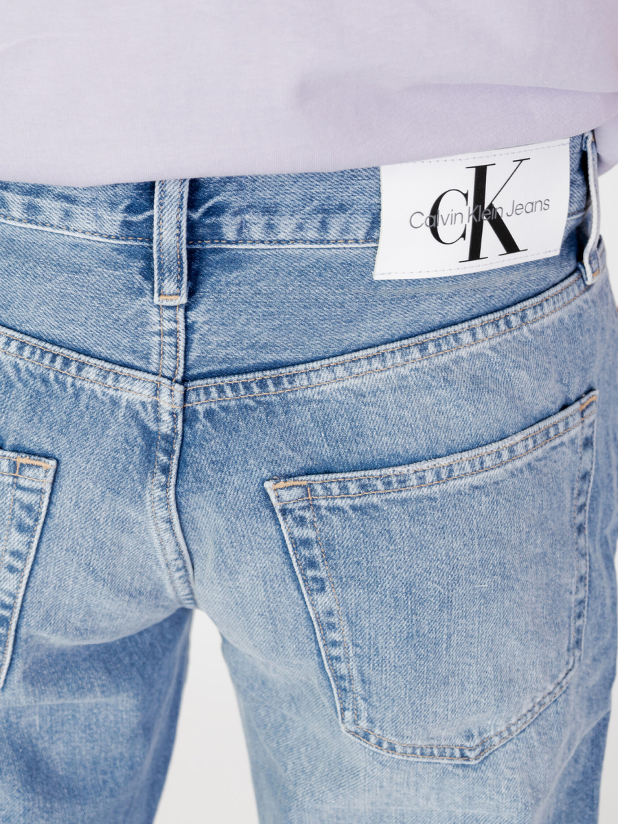 detail Calvin Klein pánské světle modré džíny