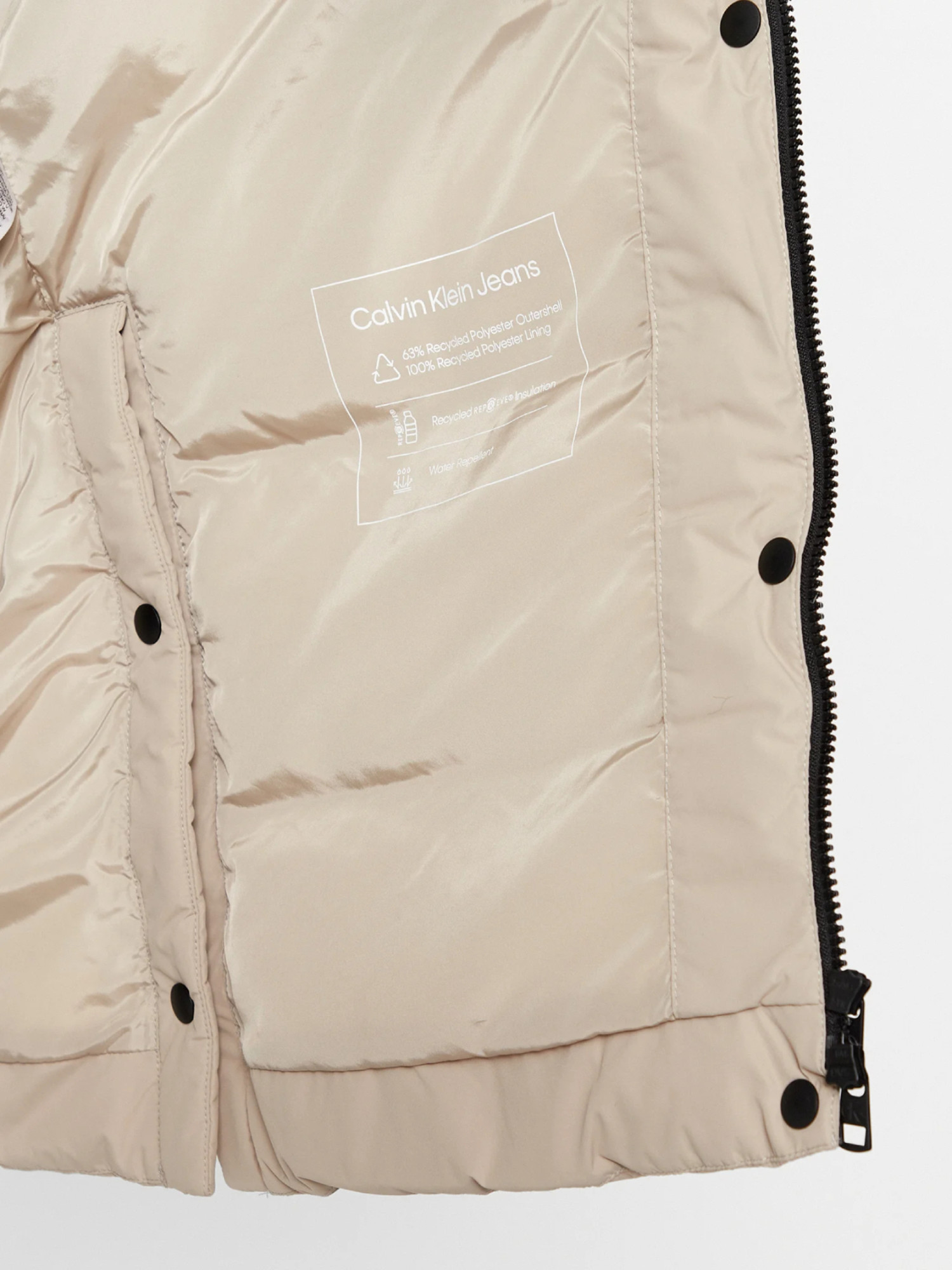 detail Calvin Klein dámský béžový kabát