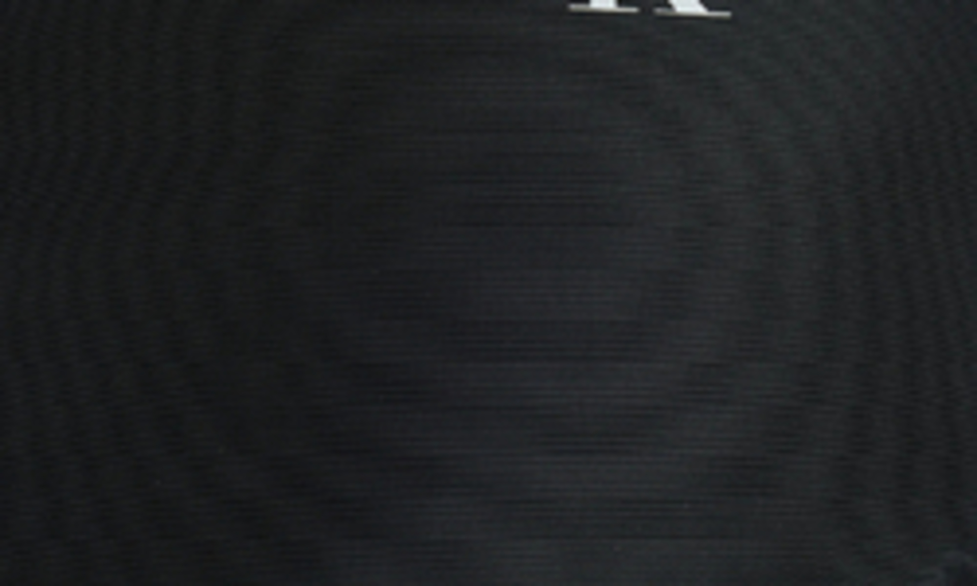 detail Calvin Klein dámský černý kabát