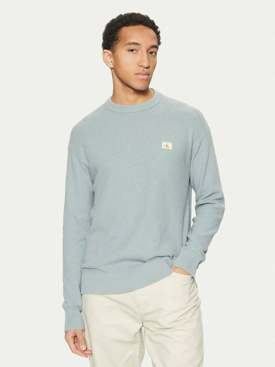 detail Calvin Klein pánský modrý svetr