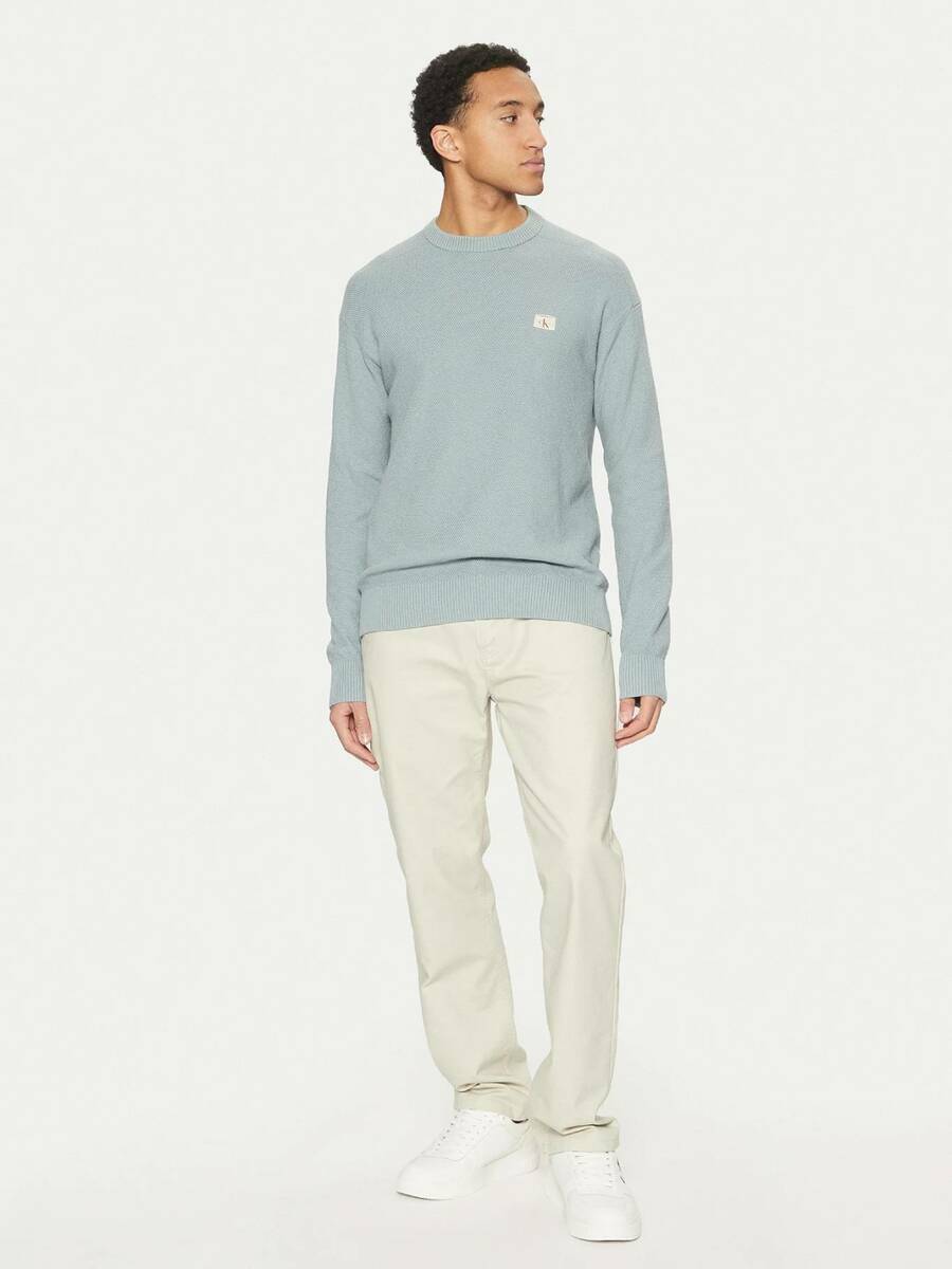 detail Calvin Klein pánský modrý svetr