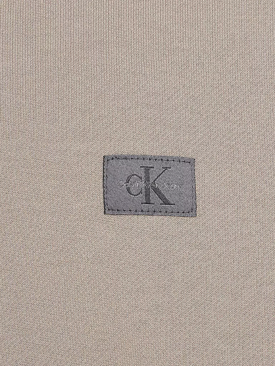 detail Calvin Klein pánská béžová mikina