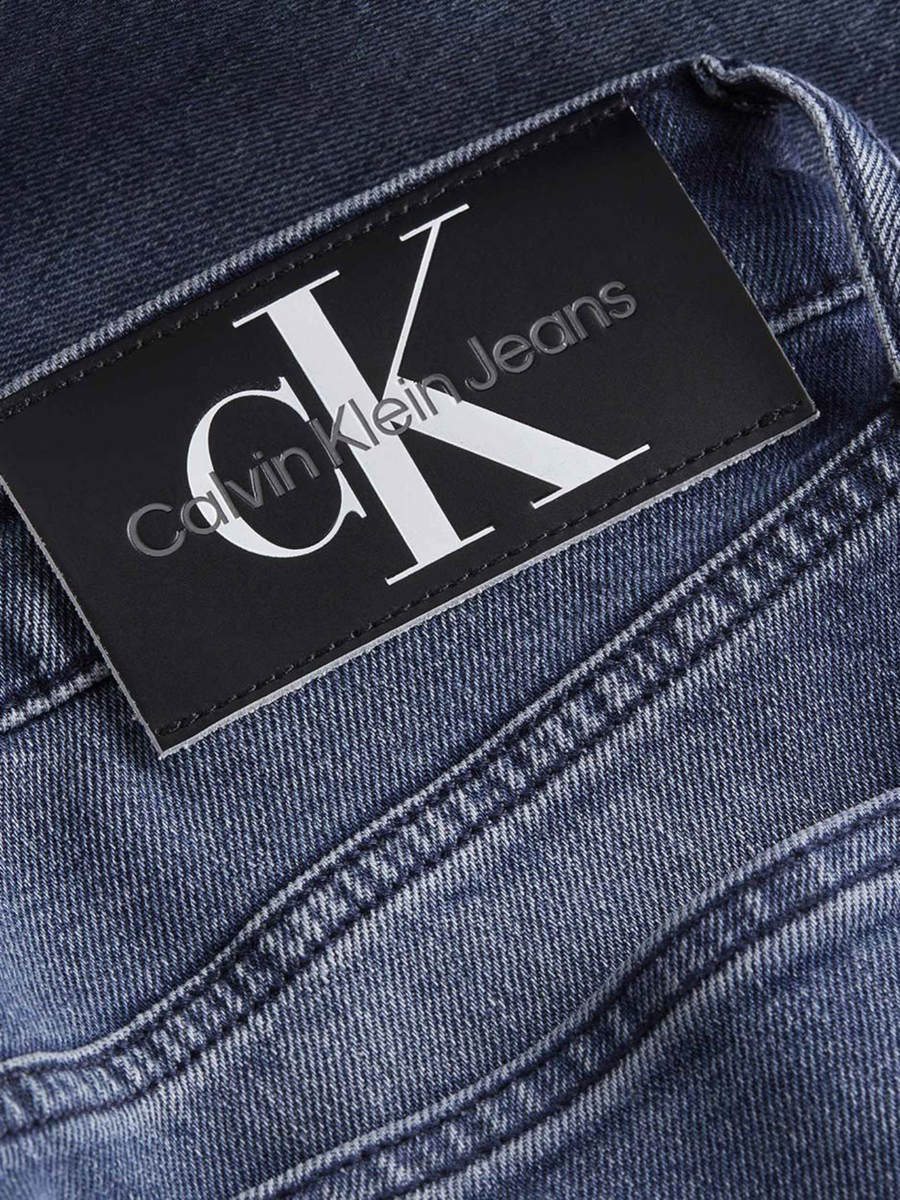 detail Calvin Klein pánské modré džíny Slim Taper