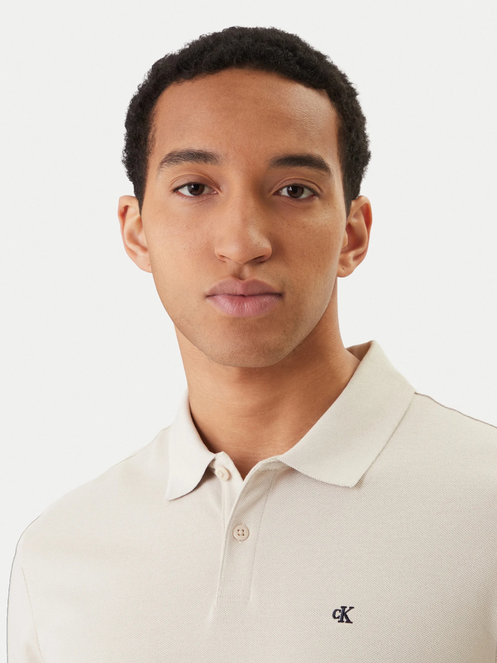 detail Calvin Klein pánské béžové polo tričko