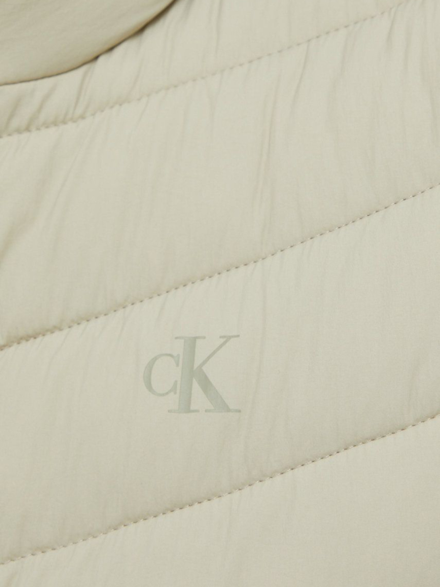 detail Calvin Klein dámská béžová bunda