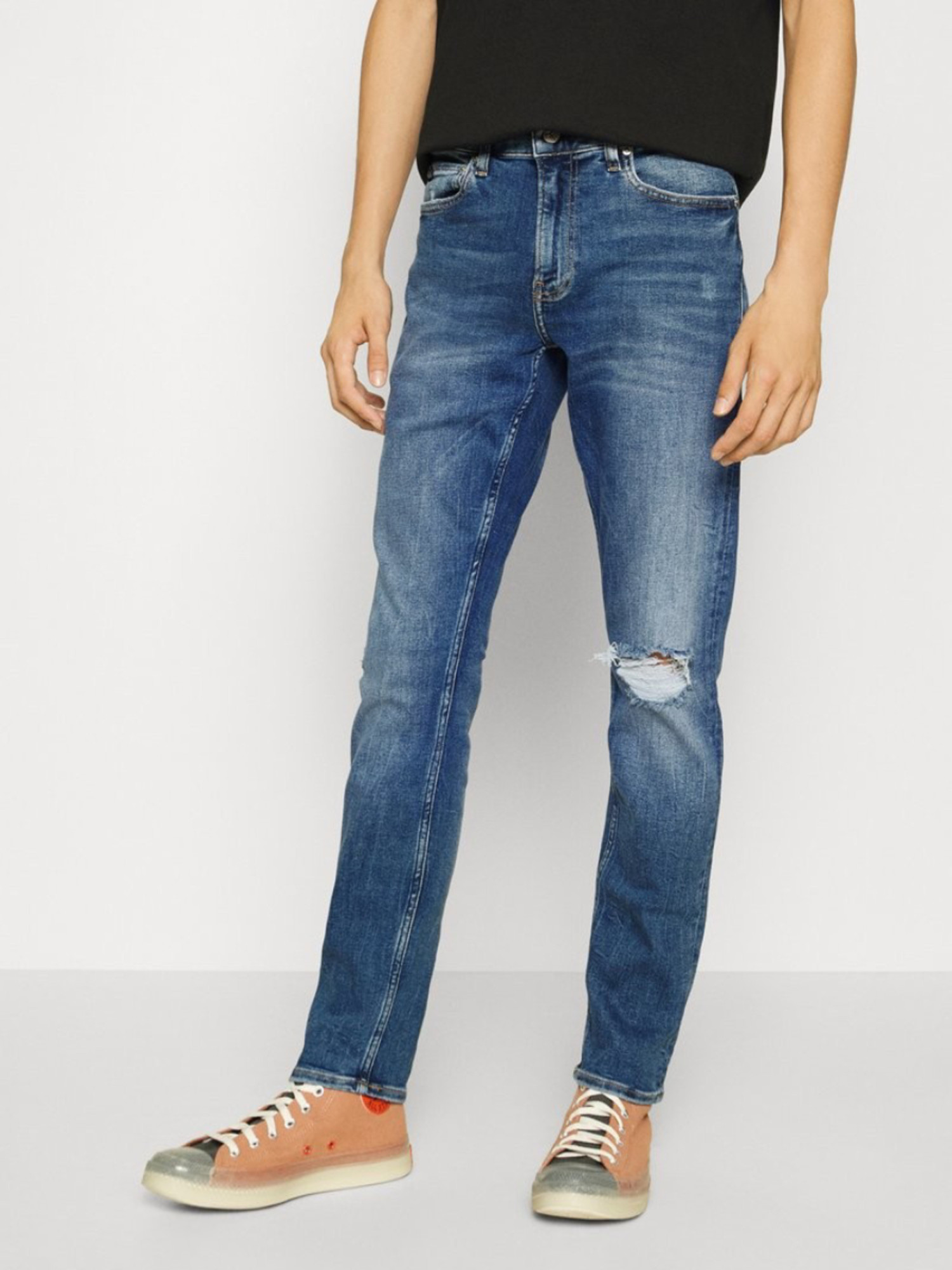 detail Calvin Klein pánské modré džíny SLIM