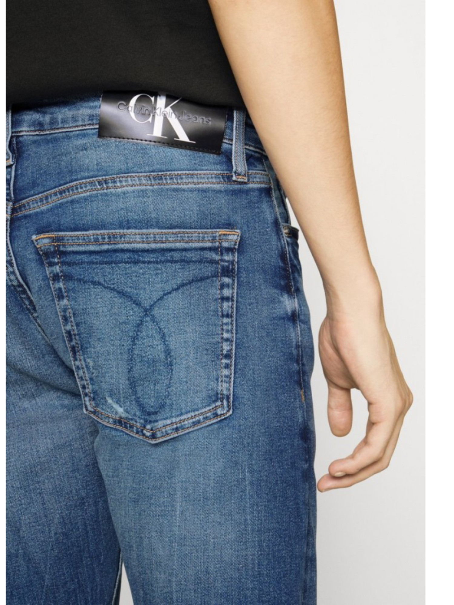 detail Calvin Klein pánské modré džíny SLIM