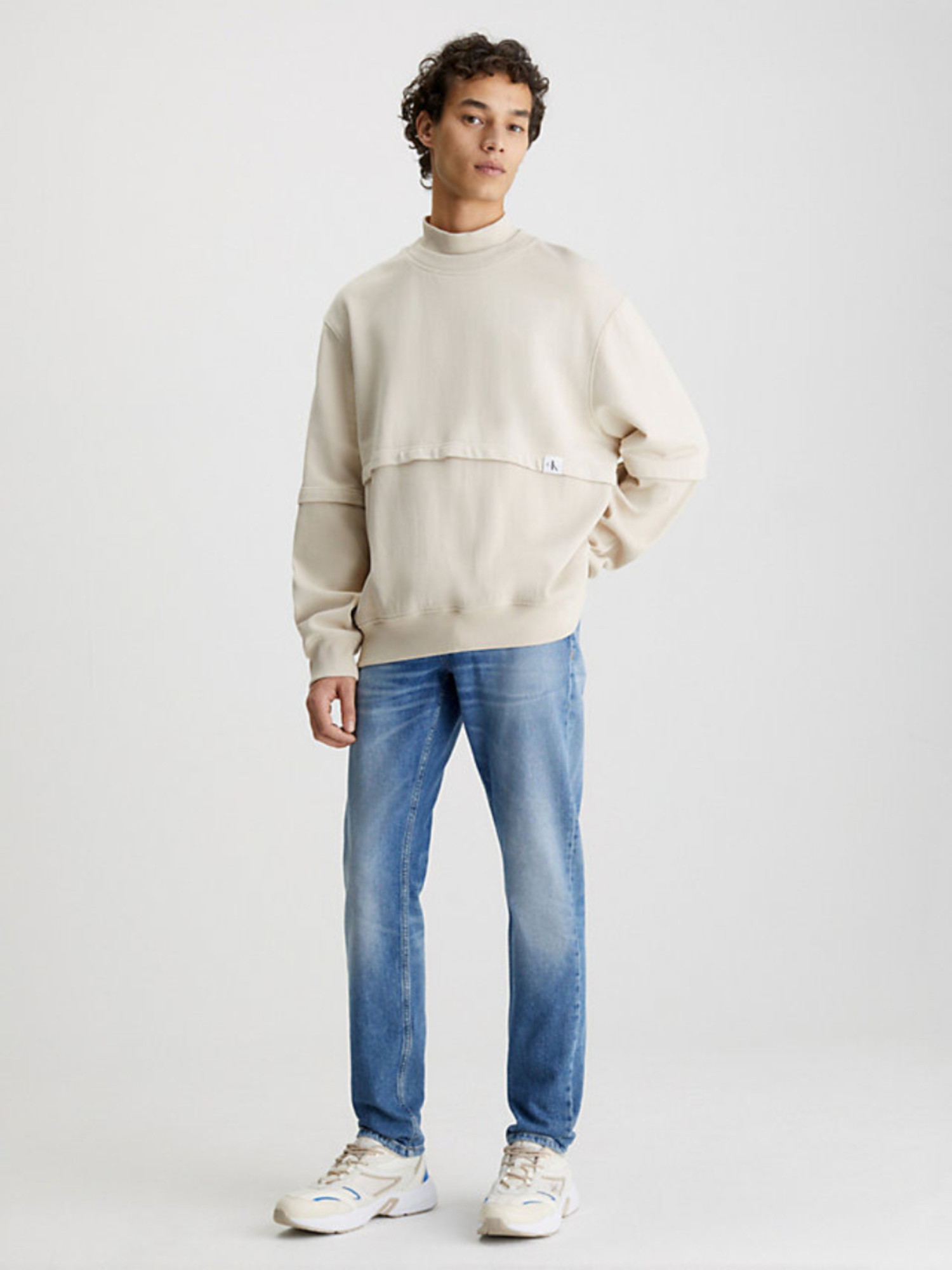 detail Calvin Klein pánské modré džíny SLIM TAPER