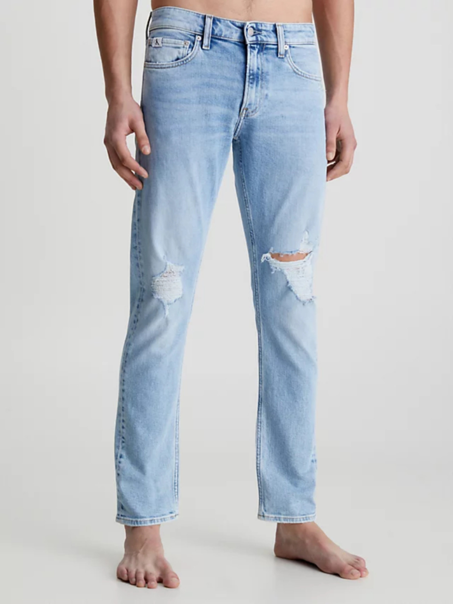 detail Calvin Klein pánské modré džíny Slim