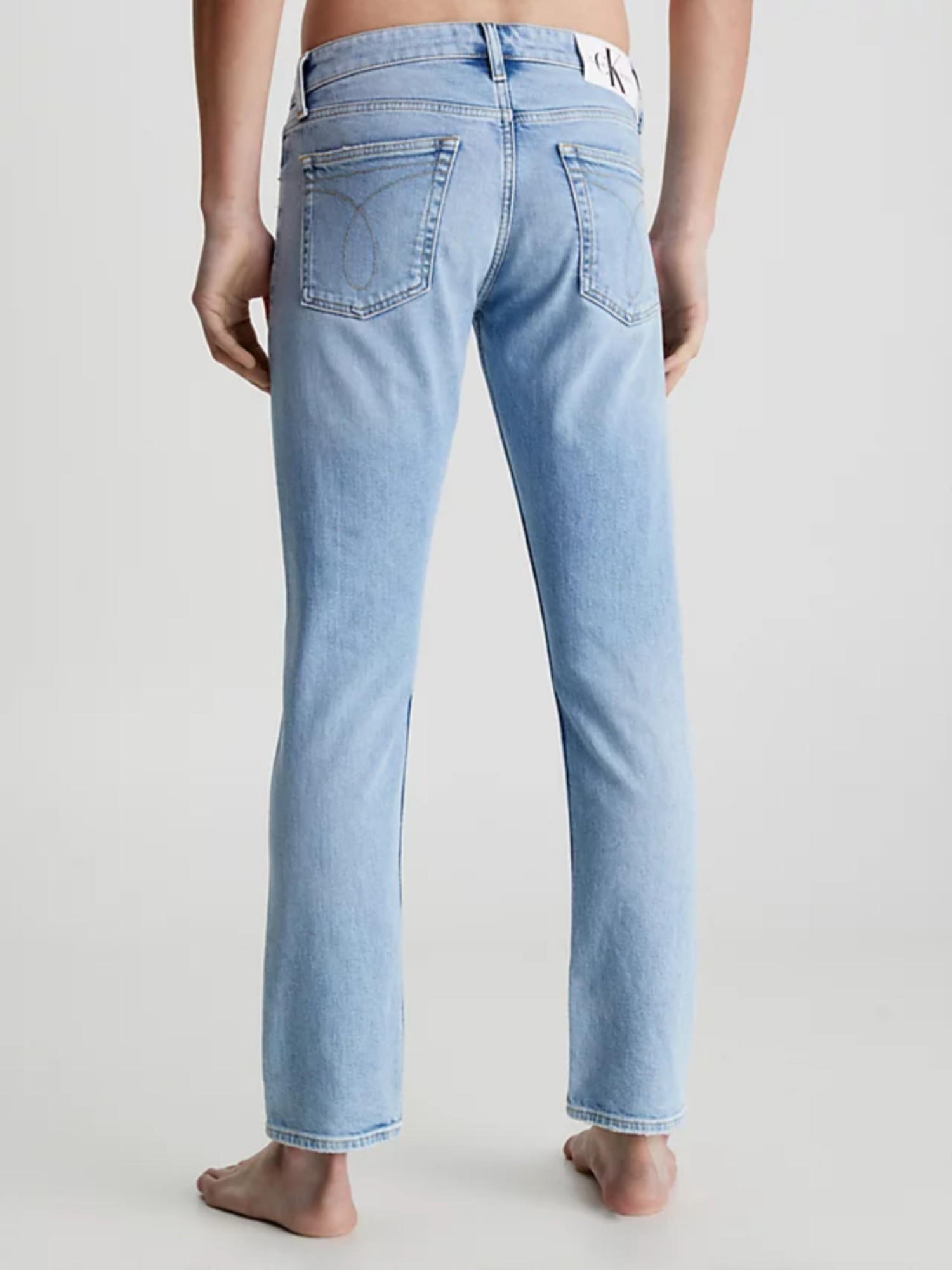 detail Calvin Klein pánské modré džíny Slim